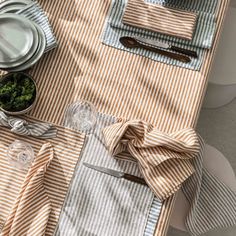 an overhead view of a table with place settings and utensils on it,