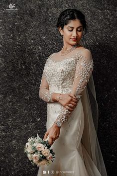 a woman in a wedding dress holding a bouquet