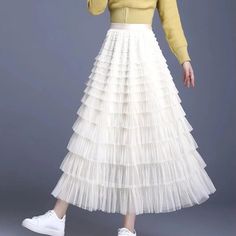 Discover the Charm of Elegance Step into a world of grace and style with our Elegant Spring/Summer Tulle Skirt. Designed for the modern woman who appreciates a blend of casual sophistication and timeless elegance, this skirt is perfect for a variety of occasions. Whether you're attending a casual gathering or dressing up for a more formal event, this skirt will elevate your wardrobe with its chic and versatile design. Product Features Material: High-quality polyester and voile blend for durability and a soft feel Style: Casual yet chic, with a solid pattern that pairs easily with any top Elasticity: Slight stretch to fit your body comfortably Season: Ideal for spring and summer wear Waistline: Empire cut to accentuate your figure Fit Type: Regular fit ensuring freedom of movement Silhouett Elegant Tiered Maxi Skirt For Spring, Elegant Ruffled Maxi Skirt For Spring, Spring Relaxed Tulle Pleated Skirt, Feminine Tiered Pleated Skirt For Spring, Elegant Spring Tiered Skirt, Spring Pleated Tulle Skirt With Relaxed Fit, Elegant Tiered Skirt For Spring, Elegant Non-stretch Tiered Skirt, White Elegant Maxi Skirt For Spring