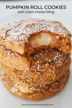 pumpkin roll cake cookies are stacked on top of each other with powdered sugar in the middle