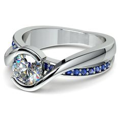 a white gold ring with diamonds on the side and a twisty band around it