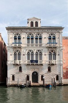 an old building is on the water in venice