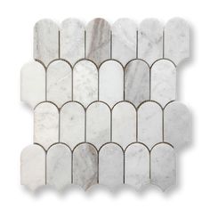 a white marble mosaic tile with an intricate design in the center and two rows of wavy lines