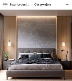 a large bed sitting in the middle of a bedroom next to a tall wooden wall