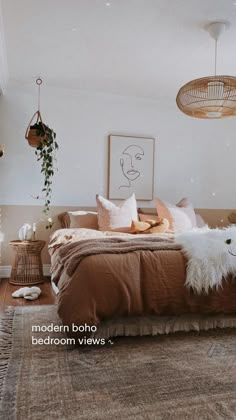 a bedroom with a bed, plants and pictures on the wall