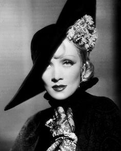 black and white photograph of a woman wearing a hat