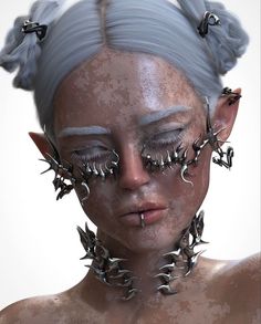 a woman with silver hair and spikes on her face