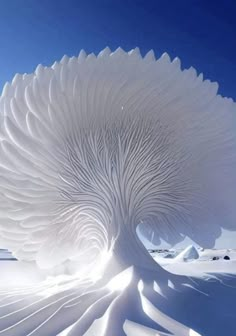 an intricate white tree in the middle of snow