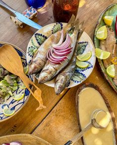 there are many different types of food on the table together, including sardines and onions