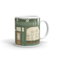 a coffee mug with an image of a store front