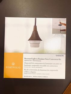 a brochure for a lamp that is hanging on a wall