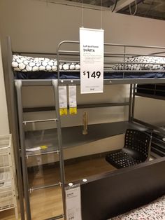 bunk beds are on display in a store with price tags hanging from the top and bottom