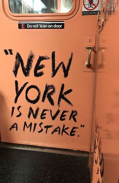 a door with graffiti on it that says new york is never a mistake