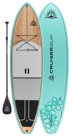 a surfboard with an oar attached to the front and back end, sitting next to a paddle board