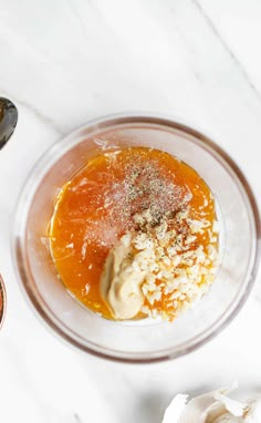 ingredients in a glass bowl on a white table