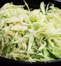 shredded cabbage in a bowl ready to be cooked