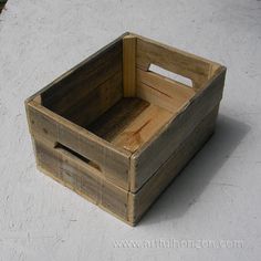 a wooden crate sitting on top of a cement floor