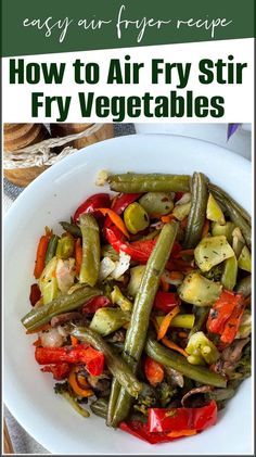 a white plate topped with green beans and red peppers