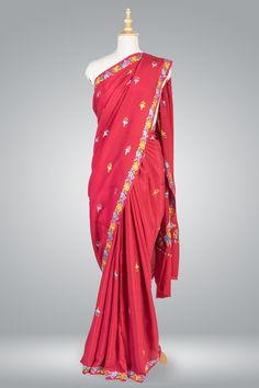 Red Saree With Florals, Kashmiri Saree, Embroidered Indian Saree Crafted by skilled artisans in the picturesque valleys of Kashmir, this saree is made from the finest quality pure crepe fabric, which drapes beautifully and feels incredibly soft against the skin. The saree's elegant black base color is beautifully contrasted by the vibrant multicolor aari embroidery, which adds a touch of sophistication and luxury to the overall design. The intricate embroidery work on the saree's pallu features Silk Traditional Wear With Floral Embroidery, Embroidered Silk Saree For Puja, Traditional Silk Wear With Floral Embroidery, Traditional Red Pre-draped Saree With Resham Embroidery, Traditional Wear With Floral Embroidery In Silk, Georgette Traditional Wear With Floral Embroidery For Ceremonies, Floral Embroidered Georgette Traditional Wear For Ceremonies, Red Embroidered Silk Traditional Wear, Red Silk Traditional Wear With Embroidery