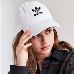 Color: White / Black Top Off Your Look With A Street-Style-Approved Cap Provided By Adidas. The Washed Strapback Dad Hat Has A Naturally Curved Bill, Breathable Embroidered Eyelets, And Adidas Trefoil Embroideries On The Front And Back. -Washed, Solid Color Dad Hat -Embroidered Adidas Logos On Front And Back -Embroidered Eyelets -Naturally Curved Bill -Adjustable Strapback Panel -One Size Fits Most -100% Cotton. New With Tag ! Thanks For Shopping @Toowendy ! Trendy White Hat For Streetwear, Trendy White Hats For Streetwear, Trendy White Streetwear Hat, Trendy White Hat With Curved Bill, Trendy White Hat With Curved Visor, Trendy White Hats With Curved Visor, Trendy White Curved Bill Hat, Adidas Cotton Hat With Curved Brim, Adidas Cotton Hats With Curved Brim