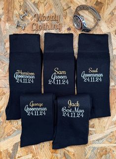 four pairs of socks with the names of grooms and bridesmaid on them