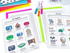 two worksheets with pictures of animals and pets on them, next to pens and markers