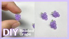 the beaded grape earrings are being made by someone using beads from their own hands