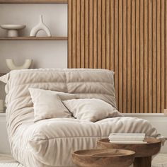 a living room with a couch, coffee table and wooden slats on the wall