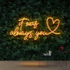 there is a neon sign that says it was always you