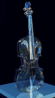 an artistic glass sculpture of a violin on a blue base with a black back ground