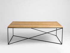 a wooden table with black metal legs and a wood top, on a white background