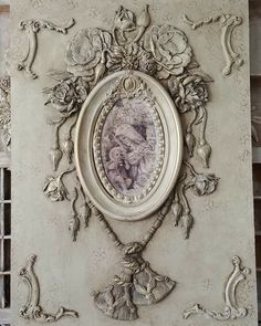 an ornate frame with a painting on it