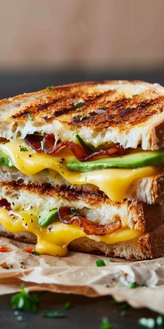 a grilled cheese sandwich with bacon, lettuce and tomato on toasted bread