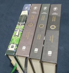 four books are stacked on top of each other in order to look like they were opened