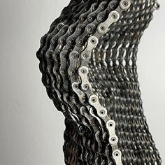 a close up of a bicycle chain on a white background