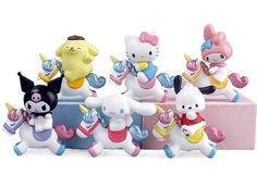 hello kitty figurines are lined up in a row