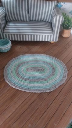 a living room with a couch and rug on the floor