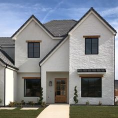 a large white house with two story windows