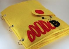 a close up of a yellow cloth with red letters on it