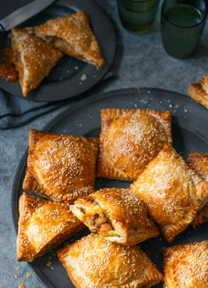 some pastries are on a black plate