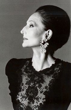 black and white photograph of a woman wearing earrings