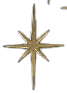 a pair of gold earrings with a star design on the front and back of each ear