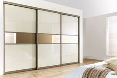 an image of a bedroom setting with sliding doors