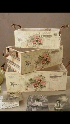 three boxes are stacked on top of each other with flowers and butterflies painted on them