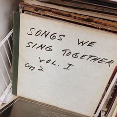 there is a sign that says songs we sing together, vol i