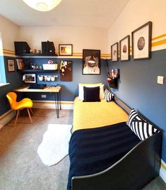 a bedroom with a bed, desk and shelves on the wall in it's corner