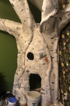 there is a paper mache that looks like a tree house