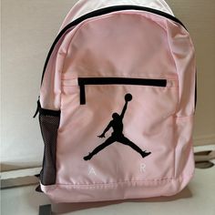 Nike Rectangular Backpack For Back To School, Nike Student Backpack, Nike Standard Student Backpack, Rectangular Pink Portable Backpack, Nike Pink Backpack For School, Pink Nike Backpack For School, Nike Bags With Zipper Closure For Back To School, Nike Pink Bag For Daily Use, Nike Pink Backpack For Travel