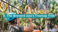 a man is hanging on ropes in front of trees with the words 8 the brevard zoo's treetop trek