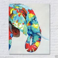 an elephant painted in bright colors on a purple background